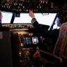 Female pilot in the cockpit.