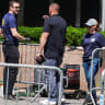 Law enforcement officers next to a cart, which according to the reports, was pushed by the suspect who deployed an incendiary deviceLaw enforcement officers work next to a cart, which according to the reports, was pushed by the suspect who deployed an incendiary device, New York,  July 20, 2026.