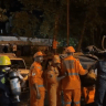First responders on scene of tunnel collapse in India, July 21, 2026.