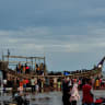 Illustrative: People gather around a boat carrying newly-arrived Rohingya refugees, after authorities prevented the refugees from disembarking and ordered them to remain on board the vessel, at Leuge Beach in Indonesia's Aceh province on January 29, 2025.