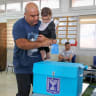 AN ARAB ISRAELI citizen casts his vote at a polling station in Mughar in the 2022 election.