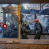 Police and emergency personnel at the scene where a balcony collapsed onto a bakery, leaving one person dead and several others injured, in Jerusalem, July 20, 2026. 