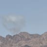 Smoke seen following reported missile launch from Iran toward Jordan, July 22, 2026.