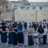 Jewish worshippers and visitors gather at the Western Wall in Jerusalem a day before the eve of Tisha B’Av, July 21, 2026.