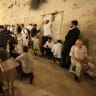 Jews pray at the Western Wall on Tisha B'Av, July 22, 2026.
