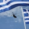 A Chinook helicopter flies during a military parade marking Greece's Independence Day, in Athens, Greece, March 25, 2026.