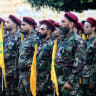 Hezbollah terrorists take part in the funeral procession of the movement's commanders Ibrahim Mohammed Kobeissi and Hussein Ezzedine, killed a day earlier in an Israeli strike on Beirut's southern suburbs, on September 25, 2024.