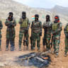 IRANIAN FEMALE fighters from the Kurdistan Freedom Party (PAK) stand with their rifles after training session at a base on the outskirts of Erbil, Iraq, in 2026.