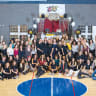 Komuna members pose for a group photo during the community's eighth-anniversary celebration.
