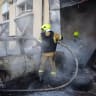 Firefighters work at the site of a car repair garage which was hit by a morning Russian missile strike, amid Russia's attack on Ukraine, in Odesa, Ukraine July 17, 2026. 