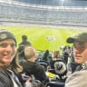 At the MCG, the writer's sister and nephew watch a game of footy.
