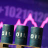 3D printed oil barrels and rising stock graph are seen in this illustration taken March 23, 2026.