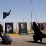 Iranian Shi'ite pilgrims walk along a road to enter Iraq through the Shalamcheh border crossing between Iran and Iraq to make their way to the holy city of Karbala to attend the Arbaeen pilgrimage, following US strikes on the Iranian side of the border crossing, in Basra, Iraq, July 23, 2026.