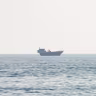 A vessel at the Strait of Hormuz, as seen from Musandam, Oman, July 23, 2026. 