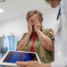 Elderly woman reacts to devastating medical test results during consultation (illustration)