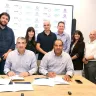 Director General of the Ministry of Welfare, Yinon Aharoni, and Sheba CEO, Prof. Yitshak Kreiss, signing the agreement