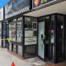 Shattered windows at Kiva’s Bagel Bar after suspected antisemitic attack in Toronto, Canada. July 26, 2026.