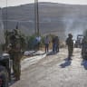 Israeli soldiers inspect the damage following an attack by Israeli settlers in the village of Sarra, near the West Bank city of Nablus, July 24, 2026.