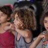 Children gather at a school-turned shelter for displaced people on the day of a visit from International ministers during a joint trip aimed at showing support for Lebanon's stability and humanitarian response in Beirut, Lebanon, June 18, 2026.