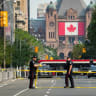 Police tape stretches across University Avenue as Toronto police work on the scene of a shooting at the US Consulate in Toronto, Ontario, Canada July 27, 2026. 