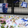 Local residents, both Jewish and non-jewish visit the inundated flower memorial next to Bondi Pavilion to pay their respects at Bondi Beach on December 16, 2025 in Sydney, Australia.