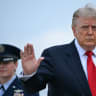 US President Donald Trump waves as he boards Air Force One at Joint Base Andrews, Maryland, on July 27, 2026.