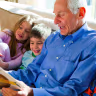 Harold Grinspoon, who launched PJ Library to bring Jewish children's books into the homes of Jewish families, reads to a group of pajama-clad kids in an undated photograph.