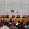 The nine-member panel at the High Court of Justice looks on as the hearing opens in Jerusalem.