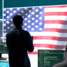 An illustrative image of a technical team in a governmental cyber environment with the USA flag.