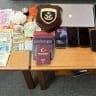 Cash, passports, suspected drugs, and electronic devices seized by the Hellenic Coast Guard during a raid on a catamaran near the Greek island of Lefkada.
