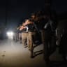 Security personnel patrols after an explosion and gunfire were reported, near offices of the Rangers, a paramilitary force, in Karachi, Pakistan, June 27, 2026. 