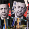 Demonstrators hold placards with portraits of Israeli Prime Minister Benjamin Netanyahu (L) and Turkish President Recep Tayyip Erdogan (R) during a protest.