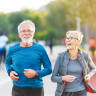 An elderly couple going for a run.