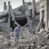 Palestinians inspect the damage caused by an Israeli airstrike that targeted a house belonging to the al-Qalqili family in al-Bureij refugee camp, central Gaza Strip, on July 30, 2026.