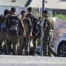 Israeli soldiers are seen outside the Sde Teiman military base near Beersheba, southern Israel, July 30, 2026.