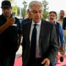 Pakistan's Defence Minister Khawaja Muhammad Asif (C) arrives at the Parliament House in Islamabad on June 10, 2025, before the presentation of the country's federal budget. 