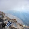 This photograph shows a Greek flag painted on rocks at the 2,918 metre high summit of Mytikas, the highest peak of Mount Olympus, northern Greece, on July 6, 2026.