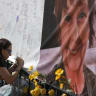 Catalina Ochoa visits a memorial for Nancy Guthrie in front of the KVOA news station on March 03, 2026 in Tucson, Arizona.
