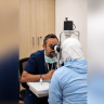 Doctor examines patient at Hadassah Medical Center.