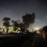 Illustrative: Black smoke rises at night after a residential block was targeted west of the Nuseirat Refugee Camp in the central Gaza Strip on July 15, 2026.
