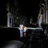 People walk down a street as Cuba's national power grid collapsed, marking the third major outage in nine days, in Havana, Cuba, July 14, 2026.