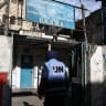 A man enters a building of the United Nations Relief and Works Agency for Palestine Refugees (UNRWA) in the Askar camp for Palestinian refugees, east of Nablus in the Israeli-occupied West Bank, on December 31, 2025.