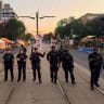 Illustrative: Police officers stand guard at the site of a deadly shooting at a salsa-themed street festival in Toronto, Ontario, Canada, July 11, 2026. 