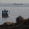 Vessels in the Strait of Hormuz, as seen from Musandam, Oman, August 3, 2026.