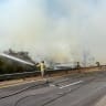 Firefighters work to contain a fire on Highway 6 on August 4, 2026. 