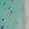 People relax along White Beach amid the coranavirus disease (COVID-19) outbreak, in Boracay Island, Aklan province, Philippines, December 1, 2021. Picture taken December 1, 2021. Picture taken with drone. 