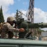 A member of the Lebanese army sits on a military vehicle in Zawtar al-Gharbiyeh, after the withdrawal of Israeli forces under a US-mediated plan, in southern Lebanon, July 26, 2026. 