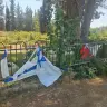 Flags placed beside the grave of Staff Sgt. Regev Amar vandalized in the Sde Nehemia cemetery in northern Israel, August 4, 2026. 