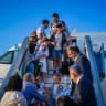 Immigrants from France are welcomed to Israel at Ben-Gurion Airport in August.