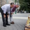 People look at an "Iran war participation trophy" installation, placed by the protest group The Secret Handshake, in New York City, US, July 29, 2026. 